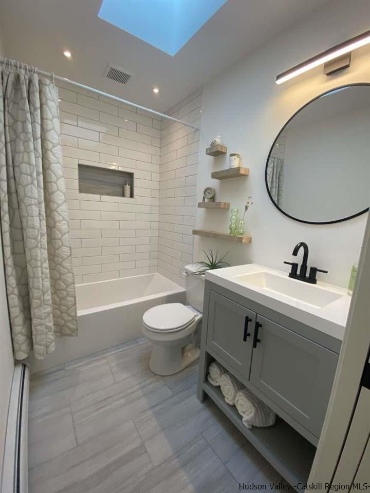 349 Co Road, Unit KRUMVILLE DAVIS CORNER RD Olivebridge, NY 12461 - Photo 11 of 25 a bathroom with a sink mirror a toilet and shower