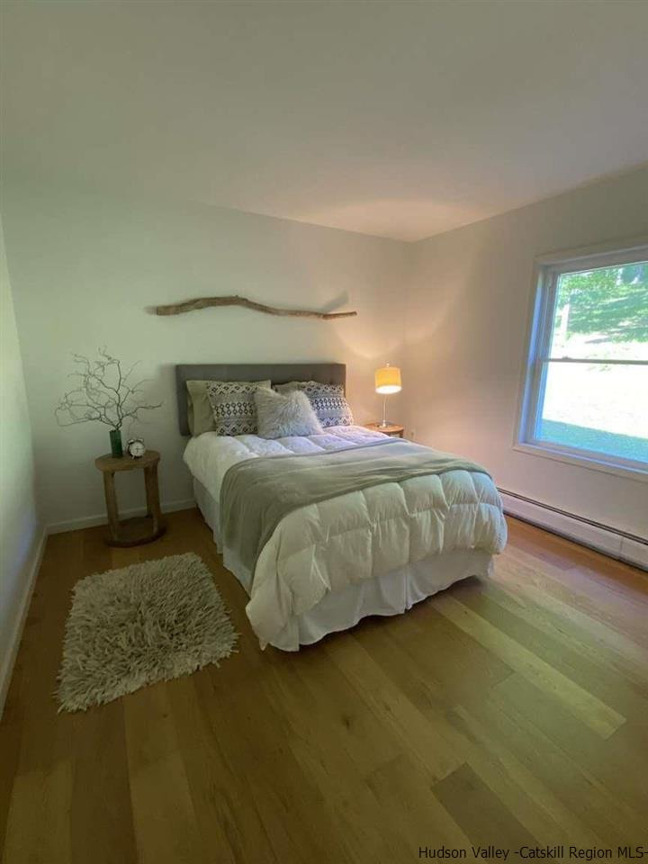349 Co Road, Unit KRUMVILLE DAVIS CORNER RD Olivebridge, NY 12461 - Photo 15 of 25 a bedroom with a bed and a window