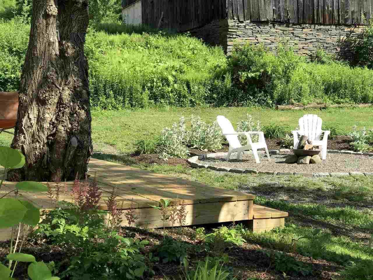 349 Co Road, Unit KRUMVILLE DAVIS CORNER RD Olivebridge, NY 12461 - Photo 19 of 25 a view of a garden with lawn chairs