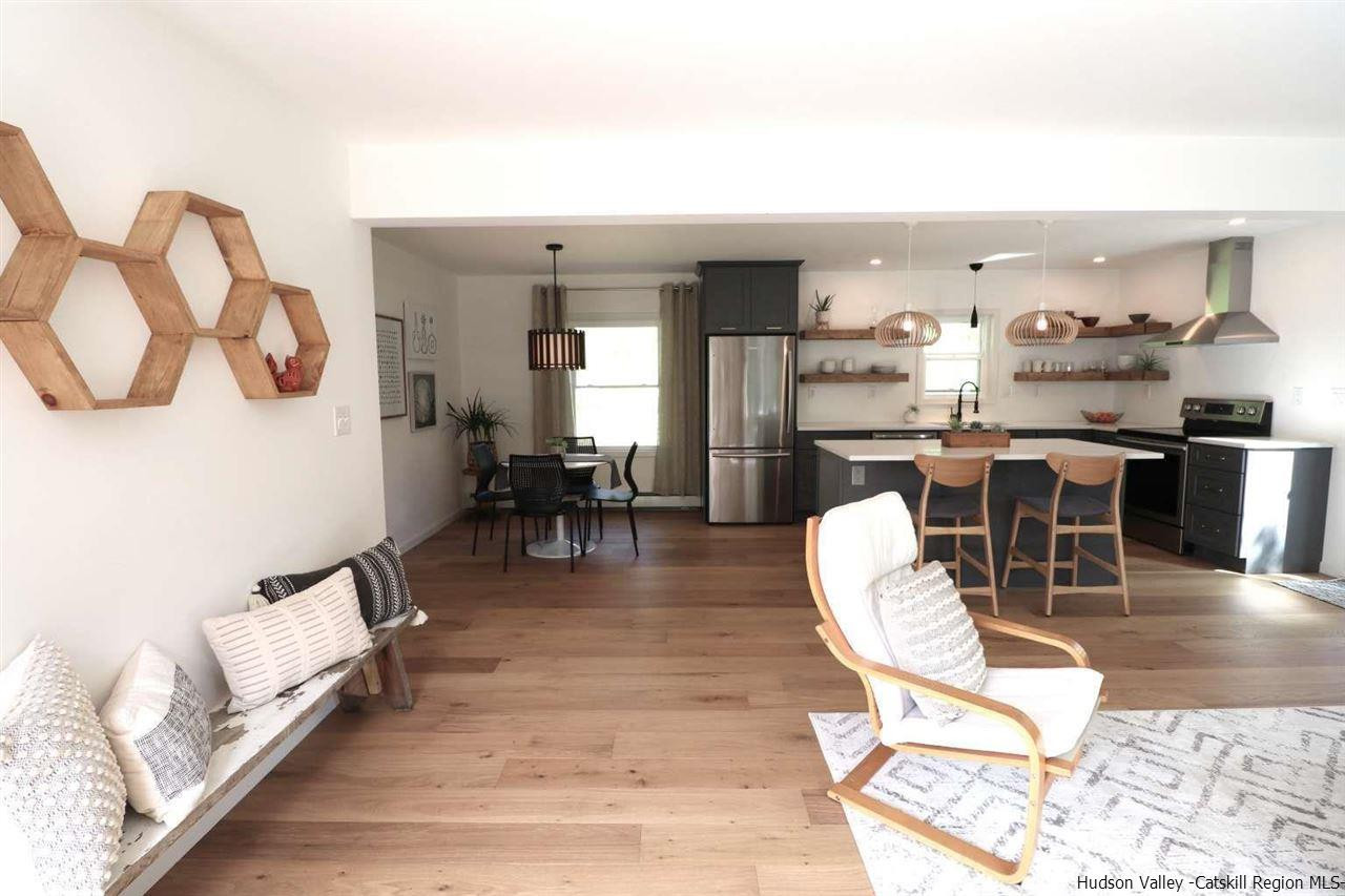 349 Co Road, Unit KRUMVILLE DAVIS CORNER RD Olivebridge, NY 12461 - Photo 2 of 25 a living room with furniture a rug and kitchen view