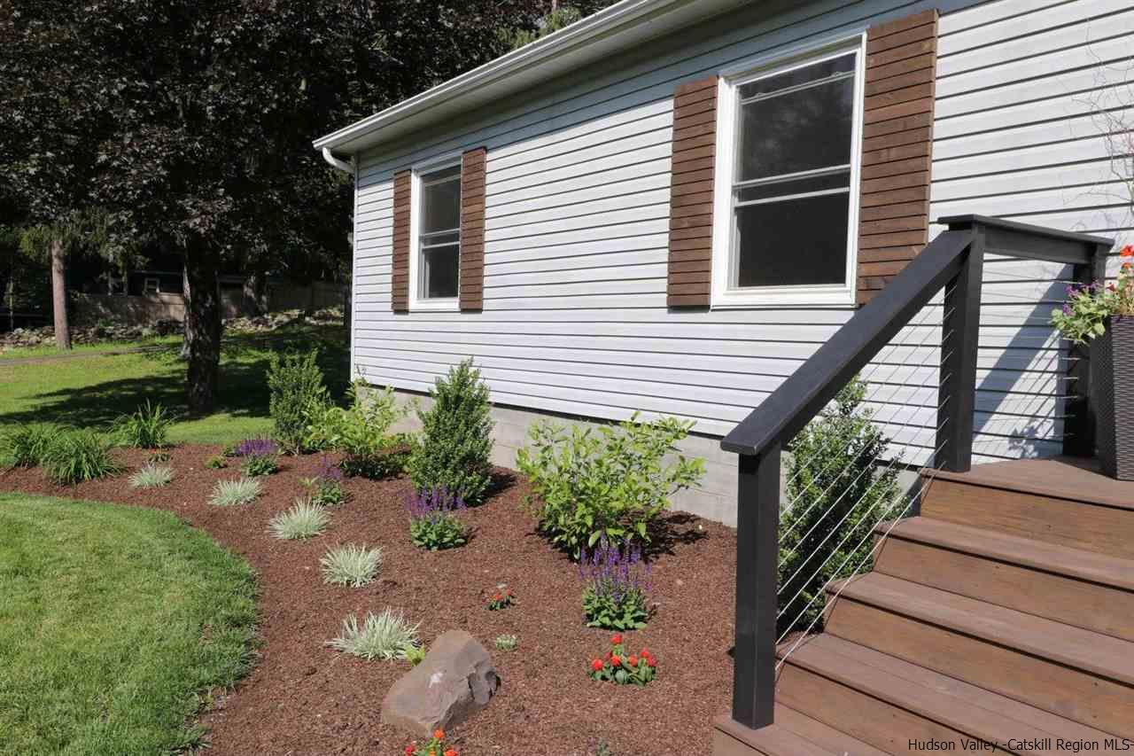 349 Co Road, Unit KRUMVILLE DAVIS CORNER RD Olivebridge, NY 12461 - Photo 23 of 25 a view of a house with backyard and sitting area