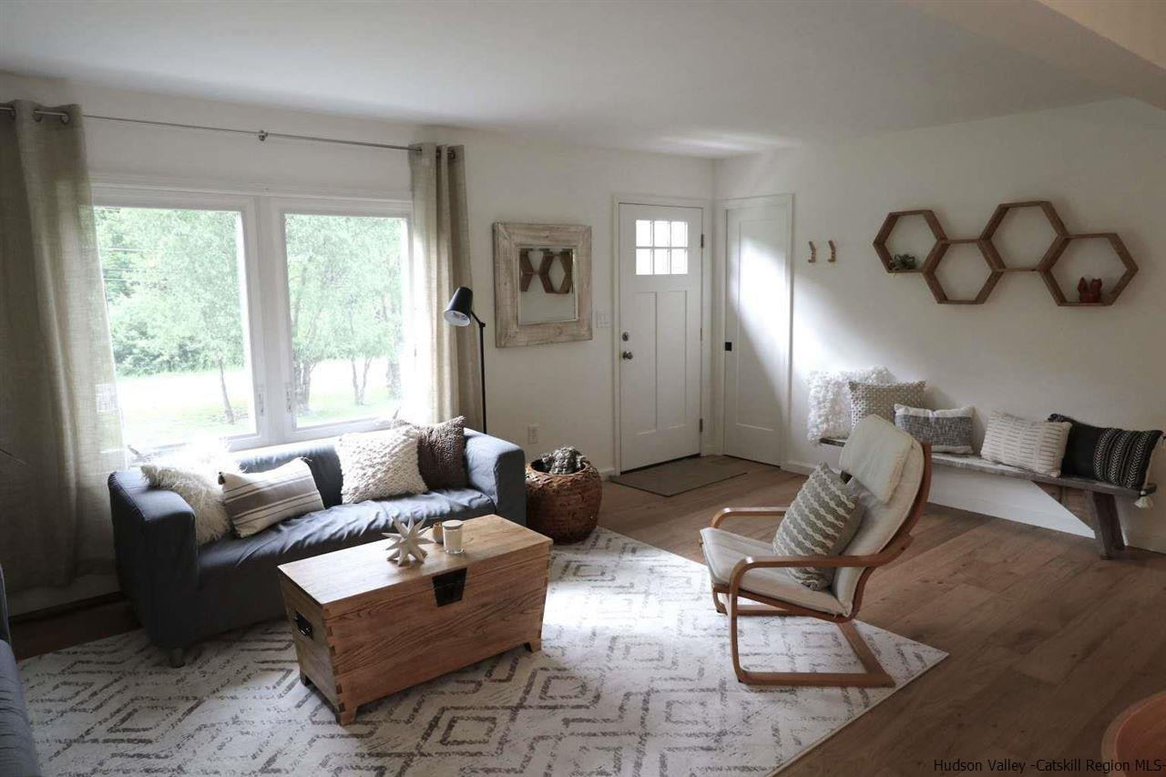 349 Co Road, Unit KRUMVILLE DAVIS CORNER RD Olivebridge, NY 12461 - Photo 3 of 25 a living room with furniture and a large window
