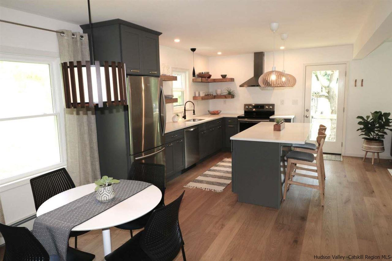 349 Co Road, Unit KRUMVILLE DAVIS CORNER RD Olivebridge, NY 12461 - Photo 5 of 25 a kitchen with a table chairs refrigerator and microwave