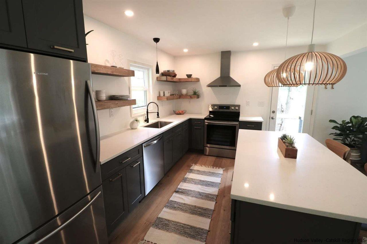 349 Co Road, Unit KRUMVILLE DAVIS CORNER RD Olivebridge, NY 12461 - Photo 6 of 25 a kitchen with stainless steel appliances a sink a stove a refrigerator and cabinets