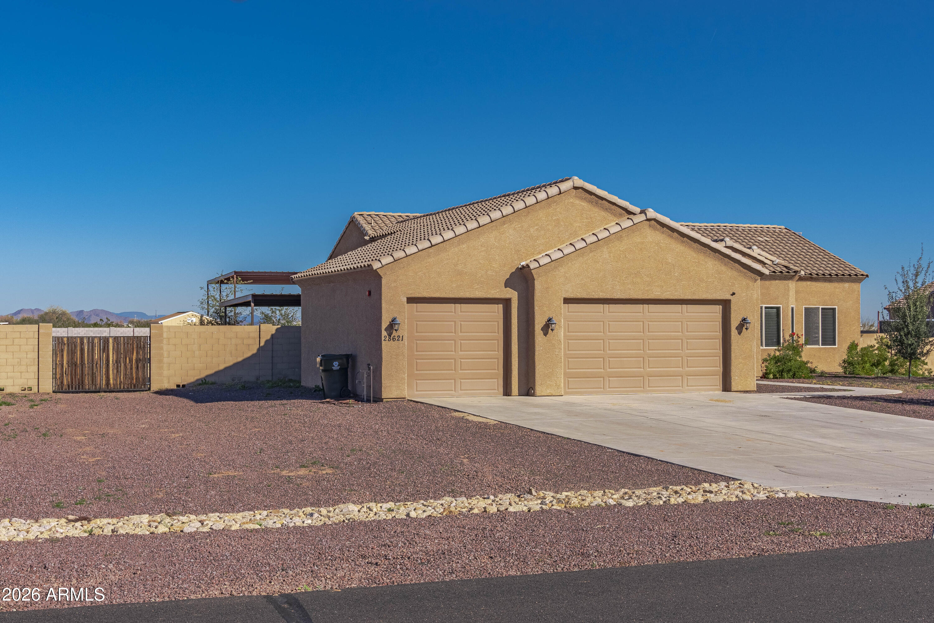 28621 North Bush Street Wittmann, AZ 85361 - Photo 17 of 41 a view of a house with a yard