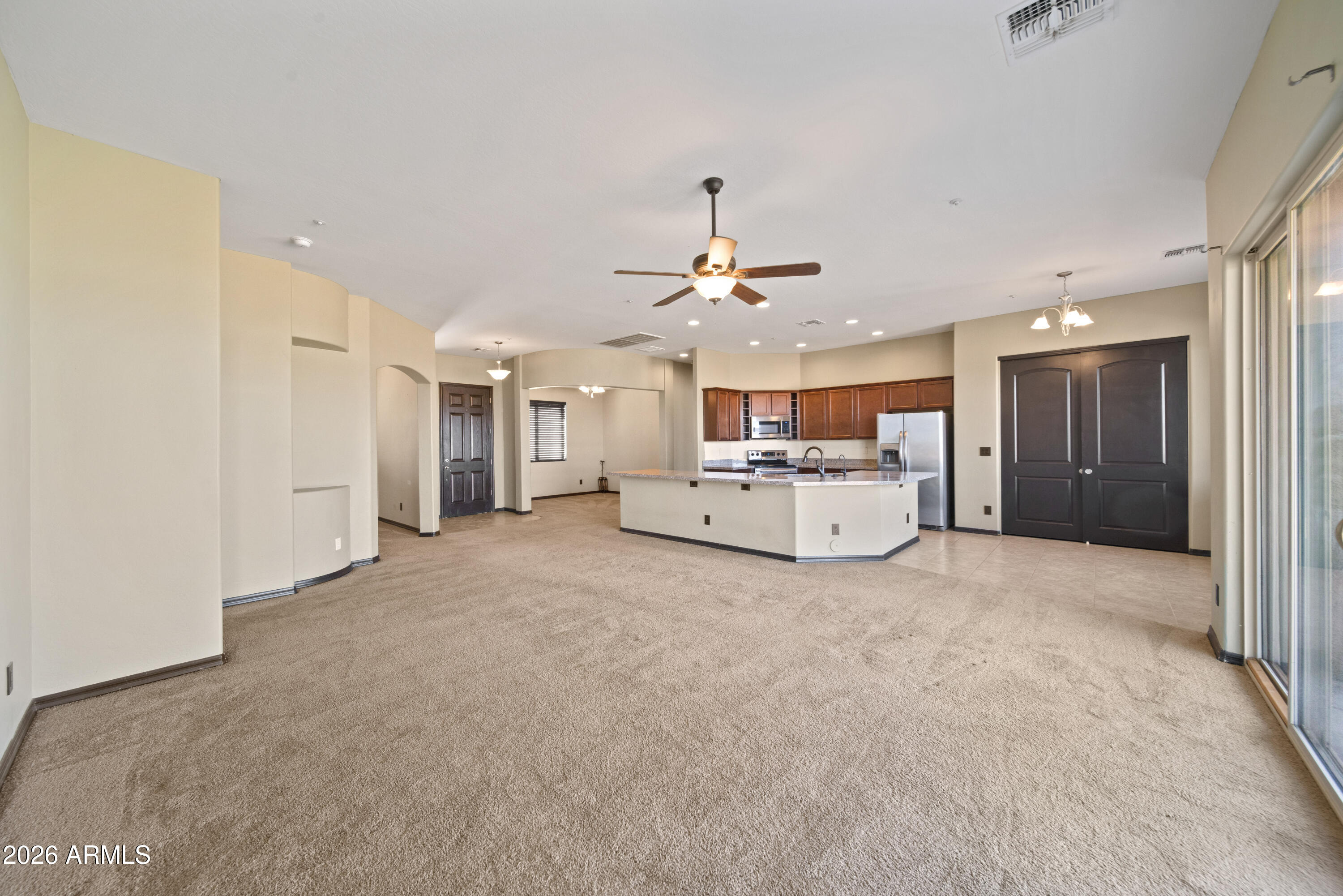 28621 North Bush Street Wittmann, AZ 85361 - Photo 20 of 41 a view of a livingroom with a kitchen