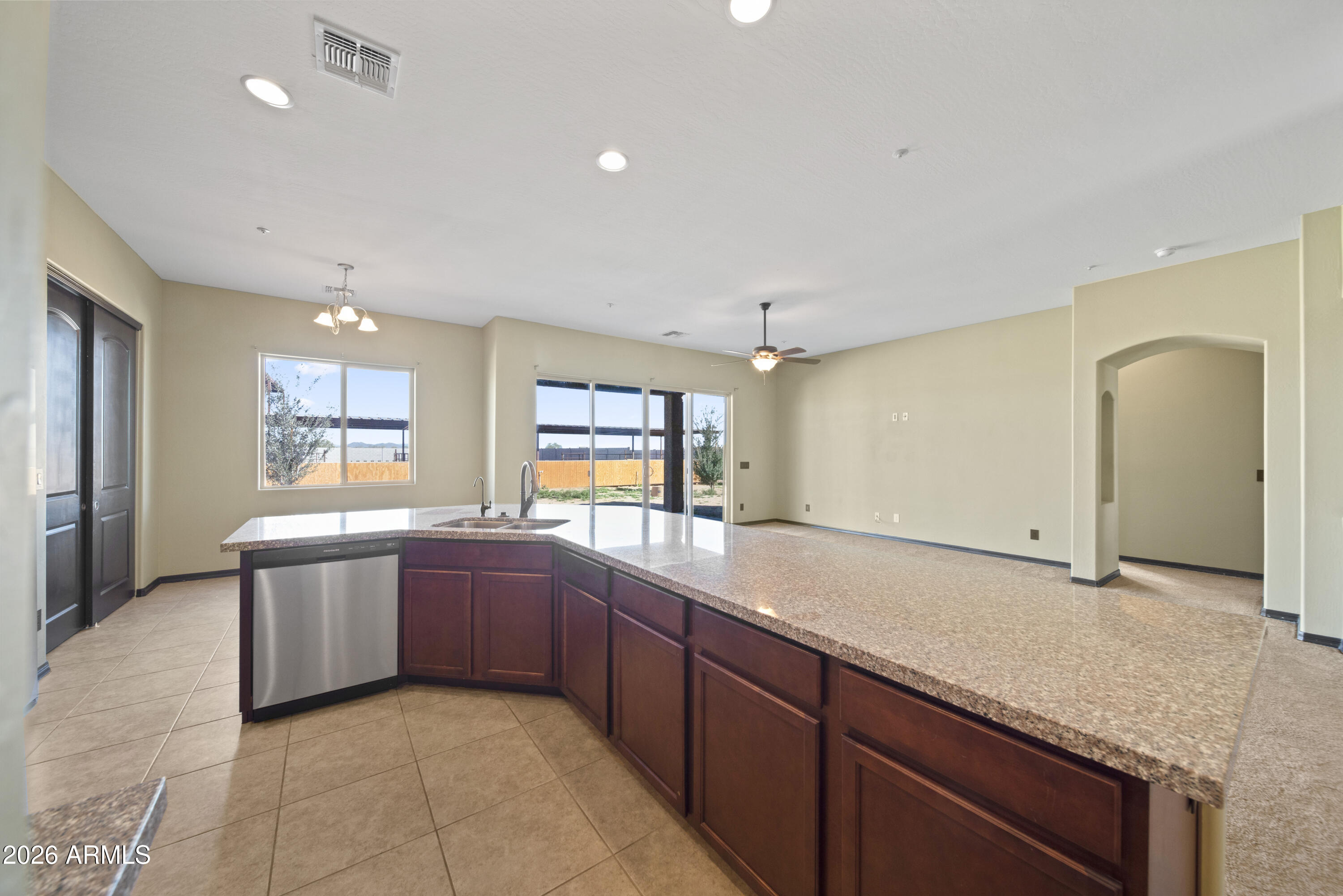 28621 North Bush Street Wittmann, AZ 85361 - Photo 26 of 41 a large kitchen with a lot of counter space and a sink