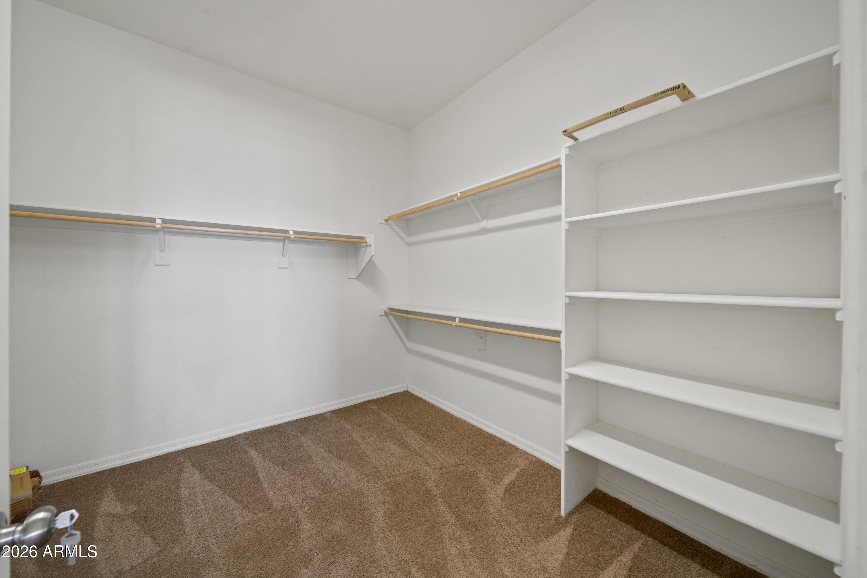 28621 North Bush Street Wittmann, AZ 85361 - Photo 34 of 41 a view of an empty walk in closet