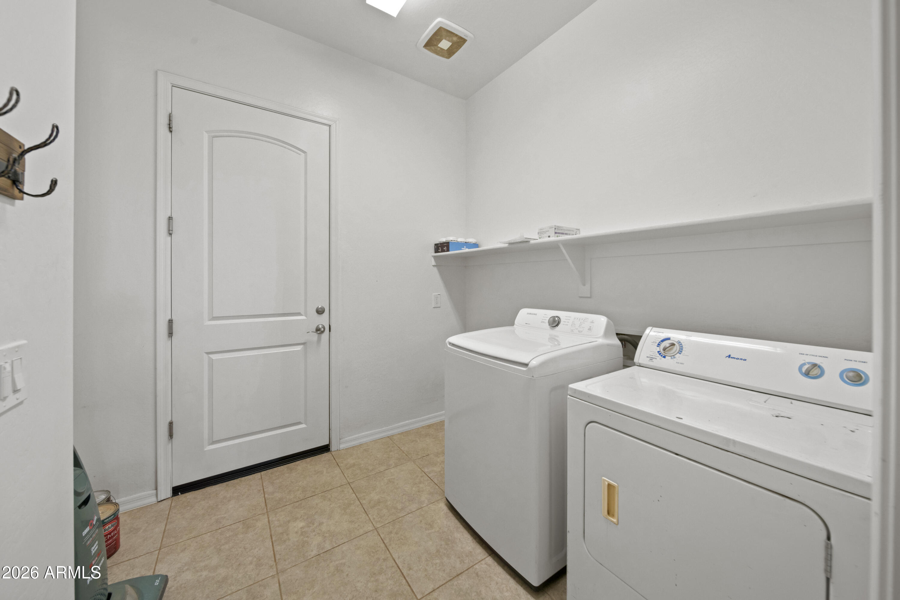 28621 North Bush Street Wittmann, AZ 85361 - Photo 37 of 41 a view of storage and utility room with washer and dryer