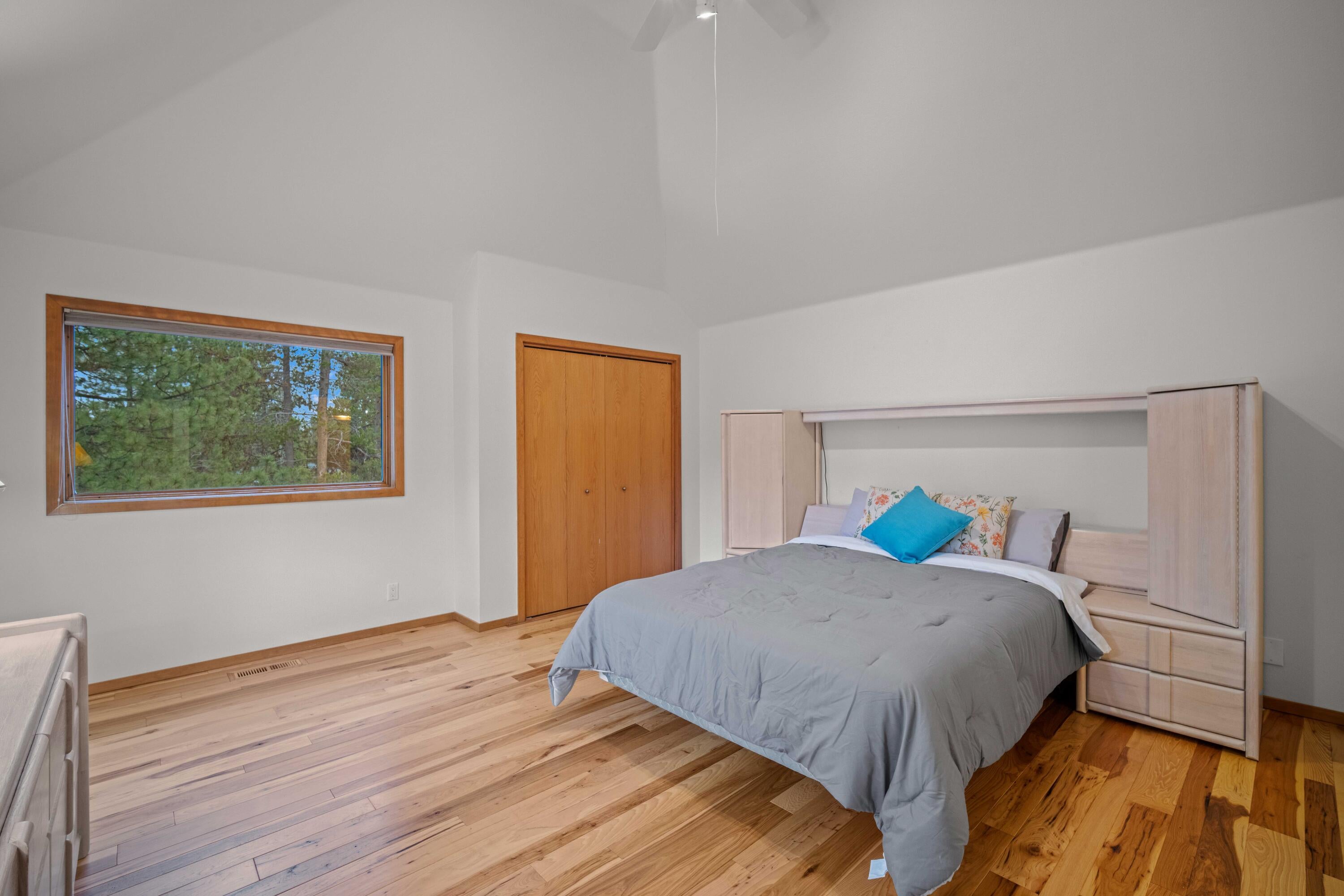 17674 Bittern Lane, Unit 7 Sunriver, OR 97707 - Photo 23 of 43 Second primary bedroom with vaulted ceilings and hardwood floors, overlooking the entry and common areas in River Village Association.