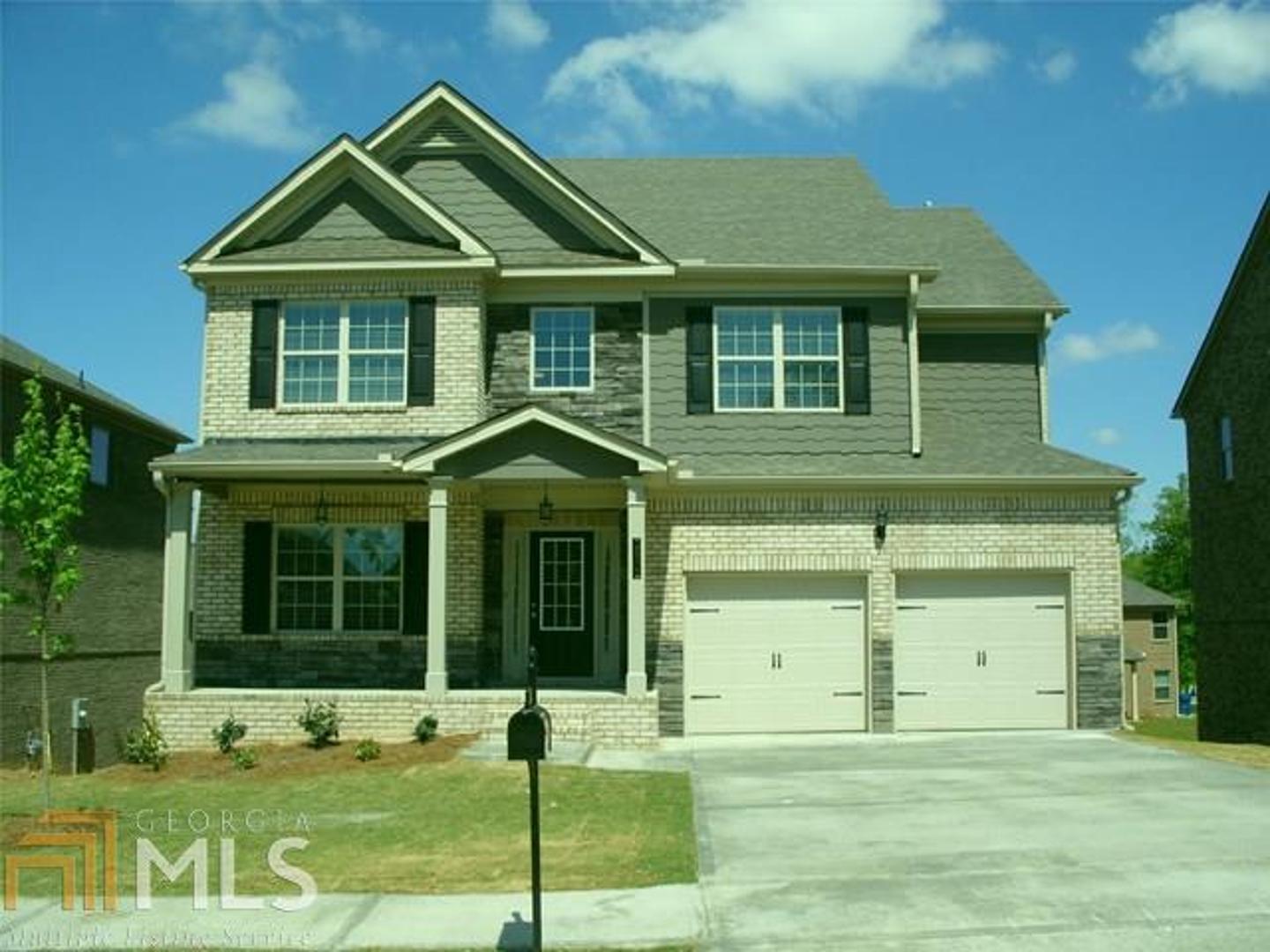 1001 Reddy Farm Lane, Unit 36 Grayson, GA 30017 - Photo 1 of 1 a front view of a house with garden