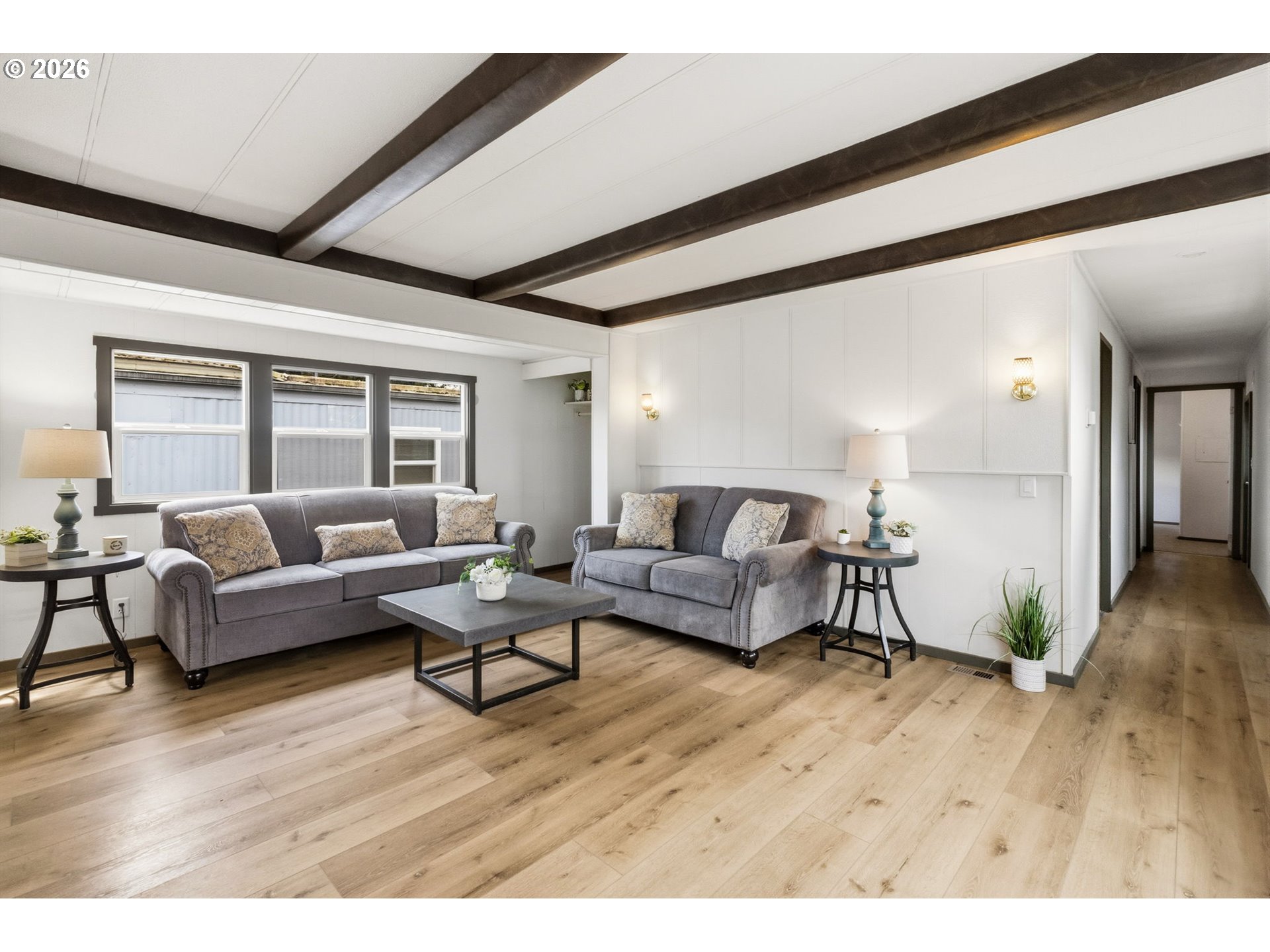205 South 54th Street, Unit 76 Springfield, OR 97478 - Photo 2 of 41 a living room with furniture and a wooden floor