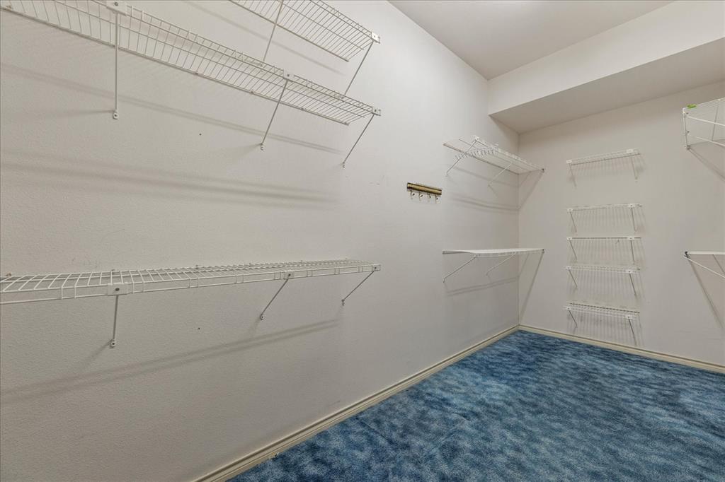 9 Willow Ridge Road Greenville, TX 75402 - Photo 18 of 31 Walk in closet with dark colored carpet
