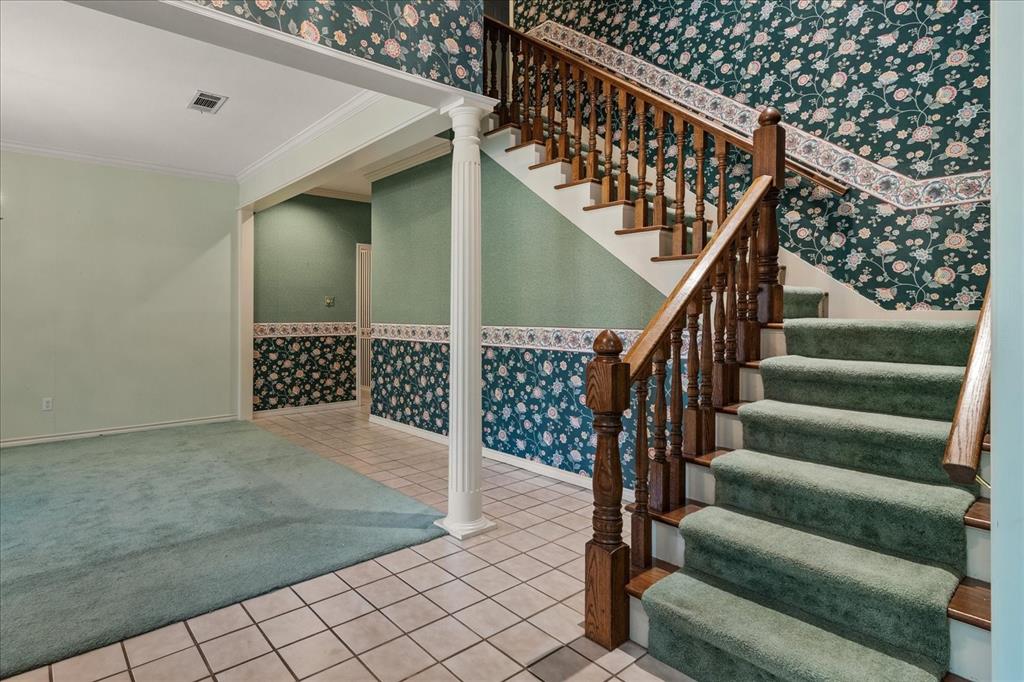 9 Willow Ridge Road Greenville, TX 75402 - Photo 5 of 31 Stairs featuring wallpapered walls, ornamental molding, tile patterned floors, and carpet