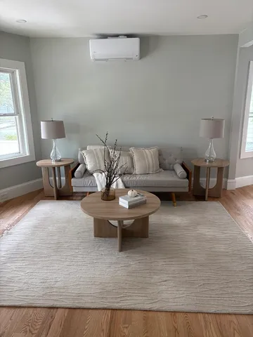 a living room with furniture and window