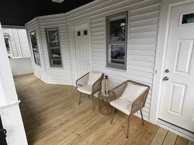 a bench sitting in front of a house