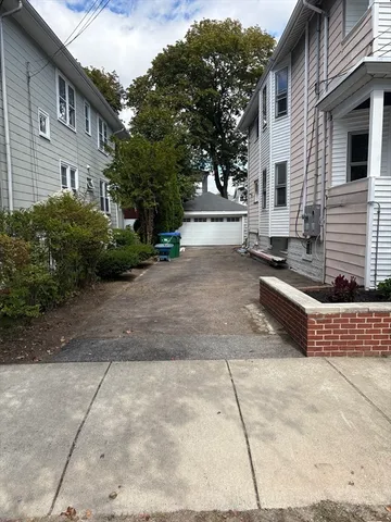 a view of a patio with couches and potted plants