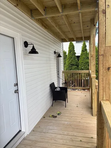 a view of a balcony with furniture