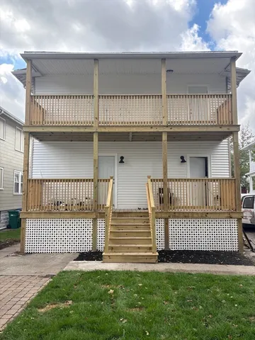 a view of a deck with a yard