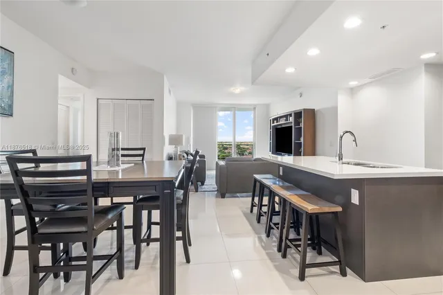 a kitchen with a table and chairs in it