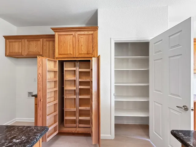 a view of closet area with empty racks