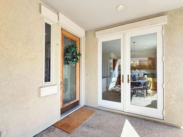 hallway with wooden floor and front door