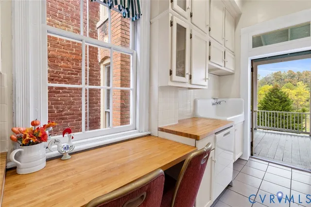 a view of a balcony with a table and chairs