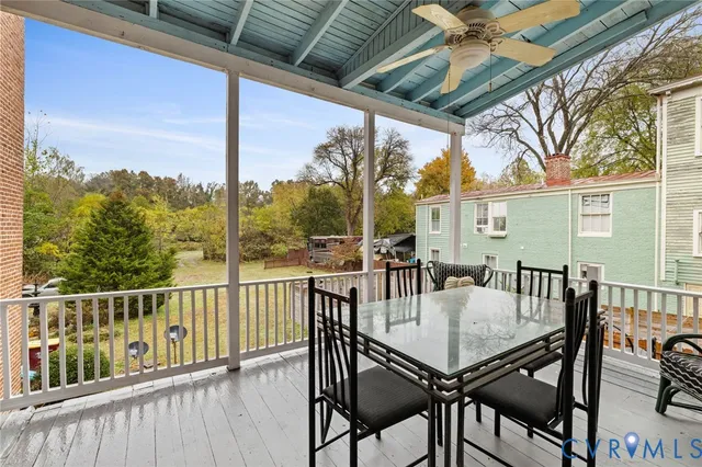 a view of a patio with a table and chairs
