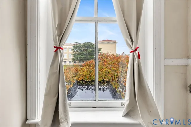 a bedroom with bed and a window