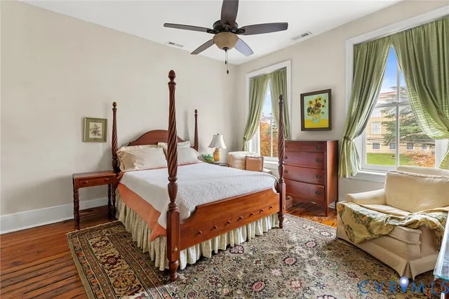 a living room with furniture a rug and a fireplace