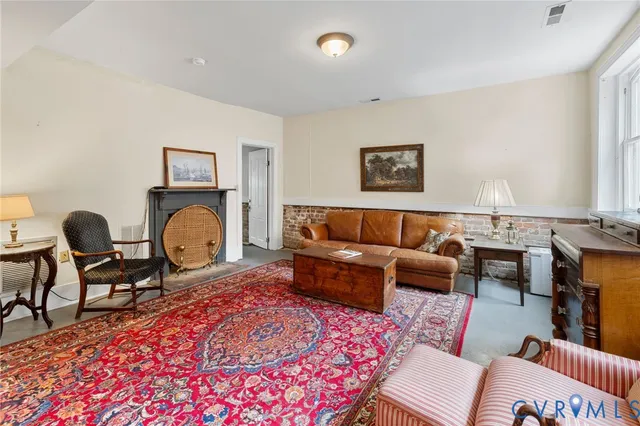 a bedroom with a bed and a television