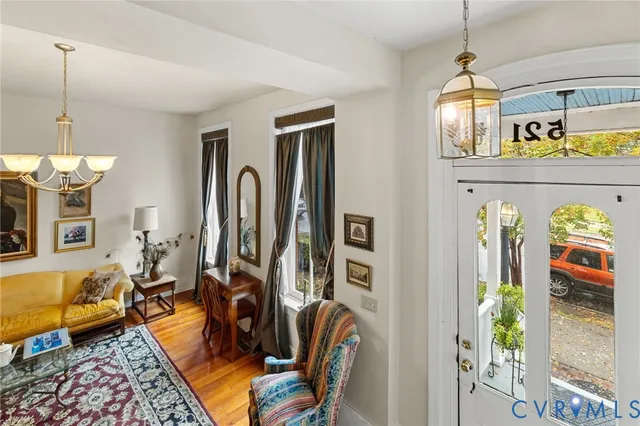 a view of a livingroom with furniture and a window