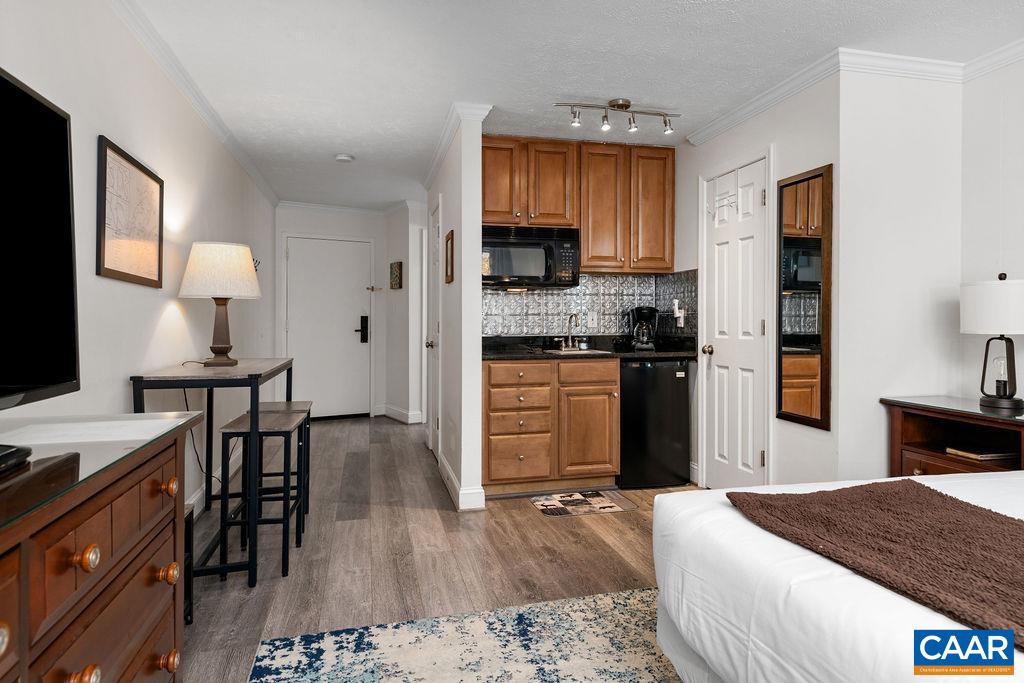 208 Timbers Roseland, VA 22967 - Photo 4 of 22 a kitchen with stainless steel appliances granite countertop a stove top oven a sink dishwasher and cabinets with wooden floor