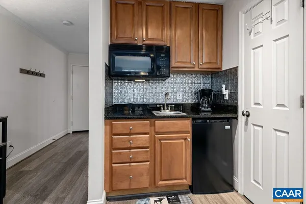 a kitchen with stainless steel appliances a refrigerator a stove a microwave and cabinets