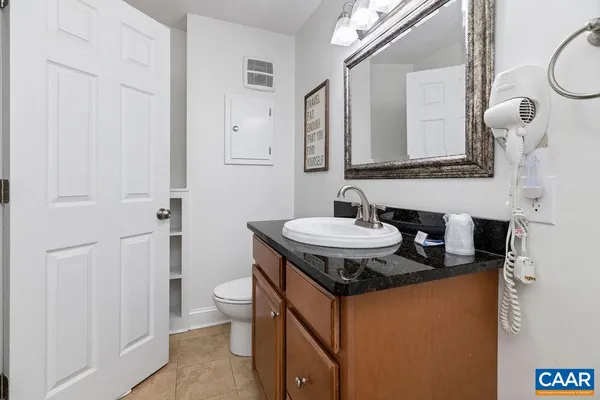 a sink and a mirror in a bathroom