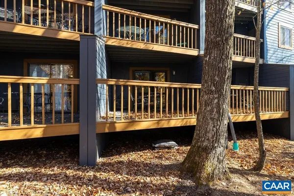 a view of a house with wooden deck