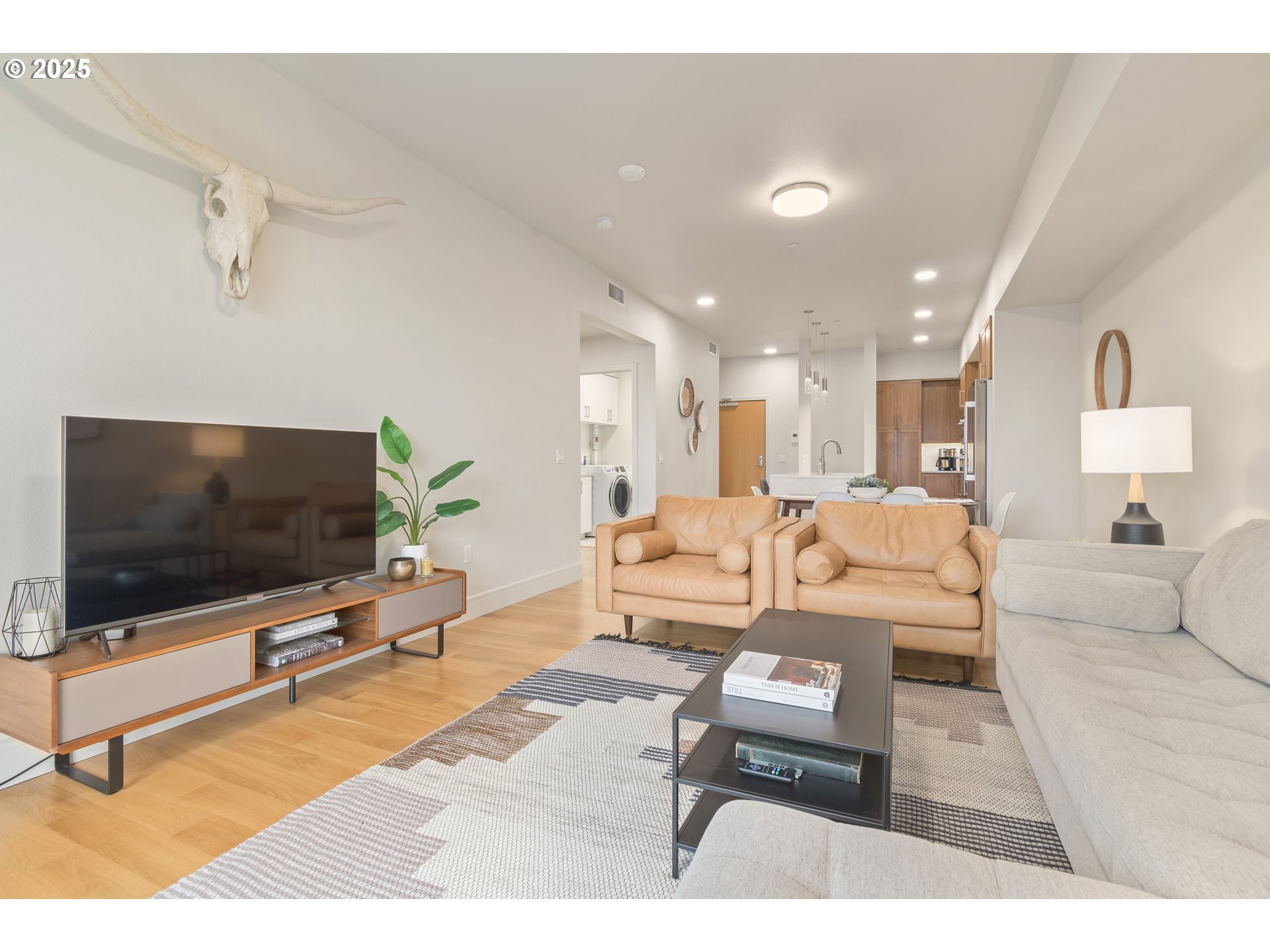 1600 Pearl Street, Unit 305 Eugene, OR 97401 - Photo 20 of 46 a living room with furniture and a flat screen tv
