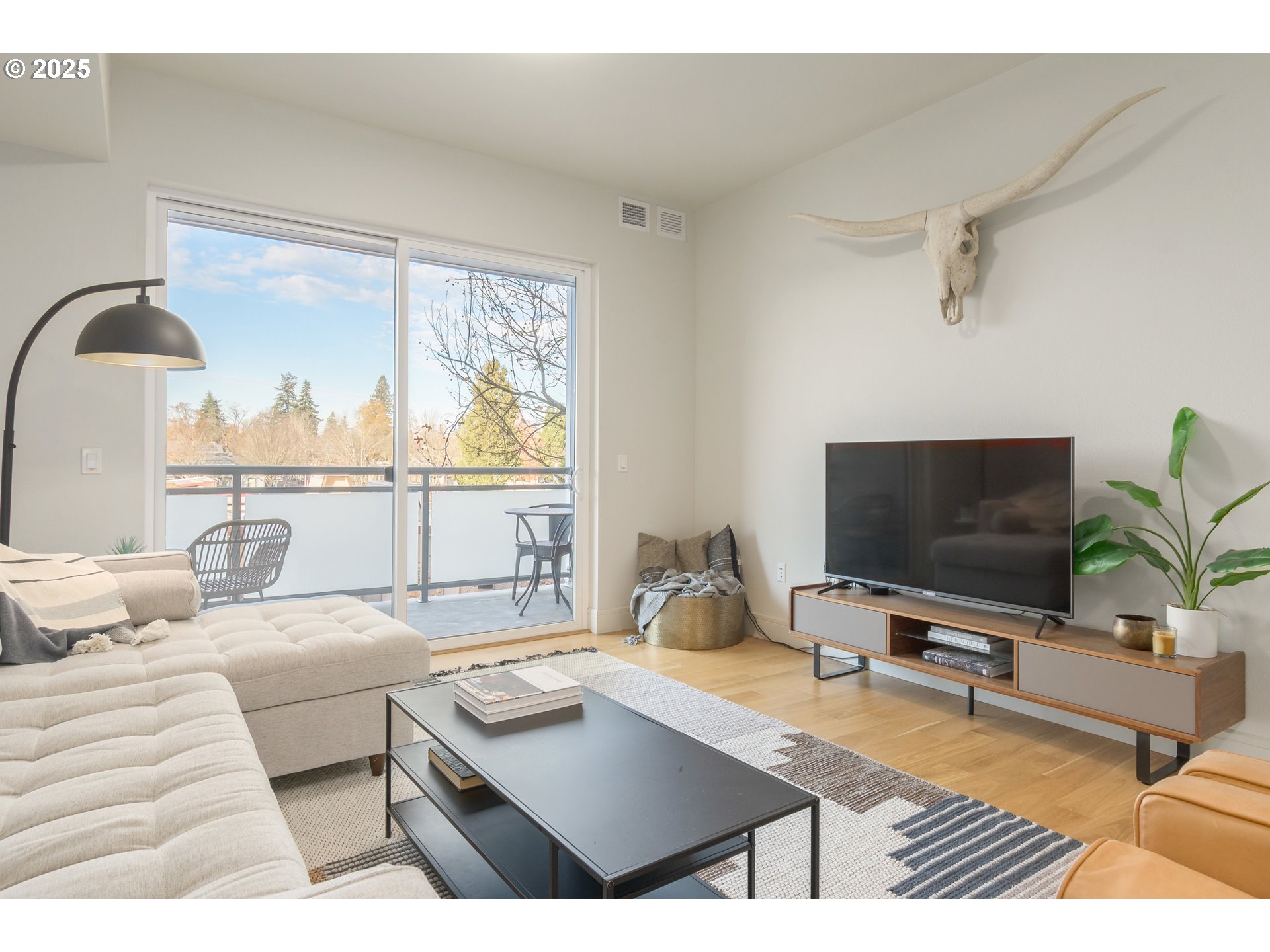 1600 Pearl Street, Unit 305 Eugene, OR 97401 - Photo 21 of 46 a living room with furniture and a flat screen tv