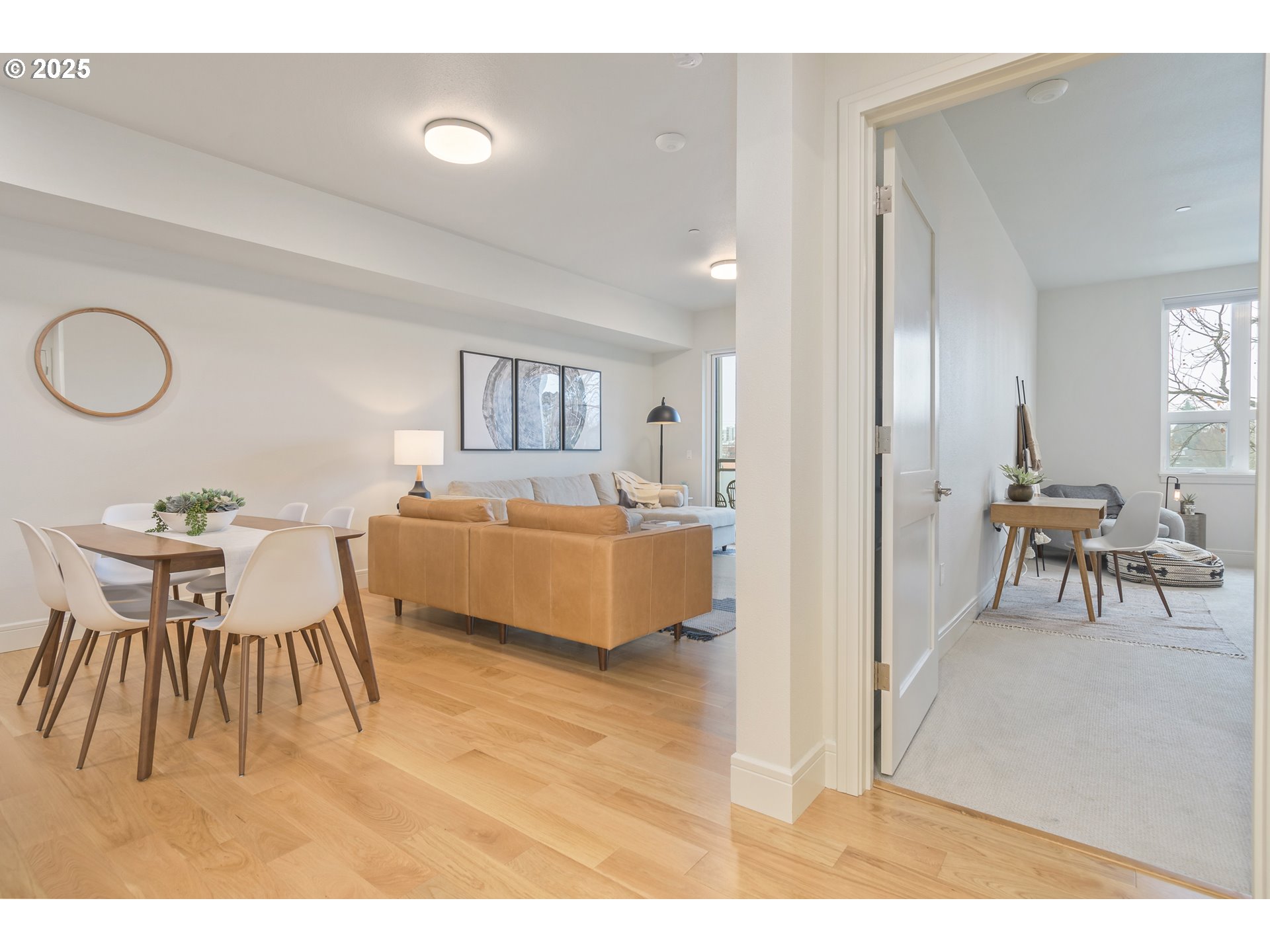 1600 Pearl Street, Unit 305 Eugene, OR 97401 - Photo 22 of 46 a living room with furniture and a wooden floor