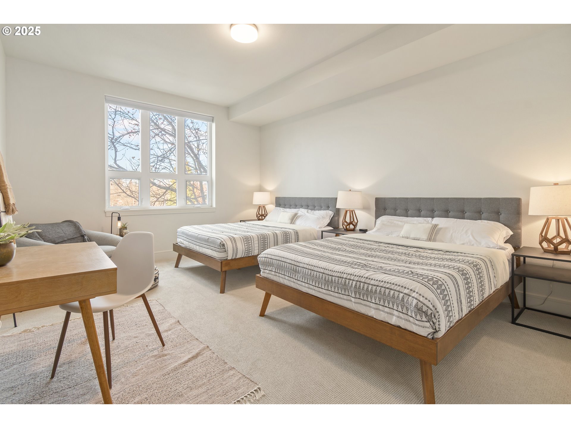 1600 Pearl Street, Unit 305 Eugene, OR 97401 - Photo 23 of 46 a bedroom with two beds and a table