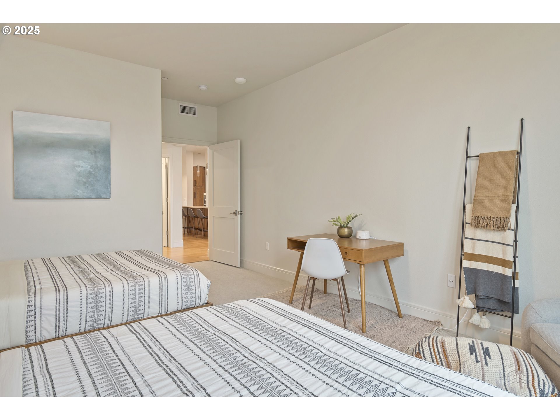 1600 Pearl Street, Unit 305 Eugene, OR 97401 - Photo 25 of 46 a view of a bedroom with furniture and wooden floor