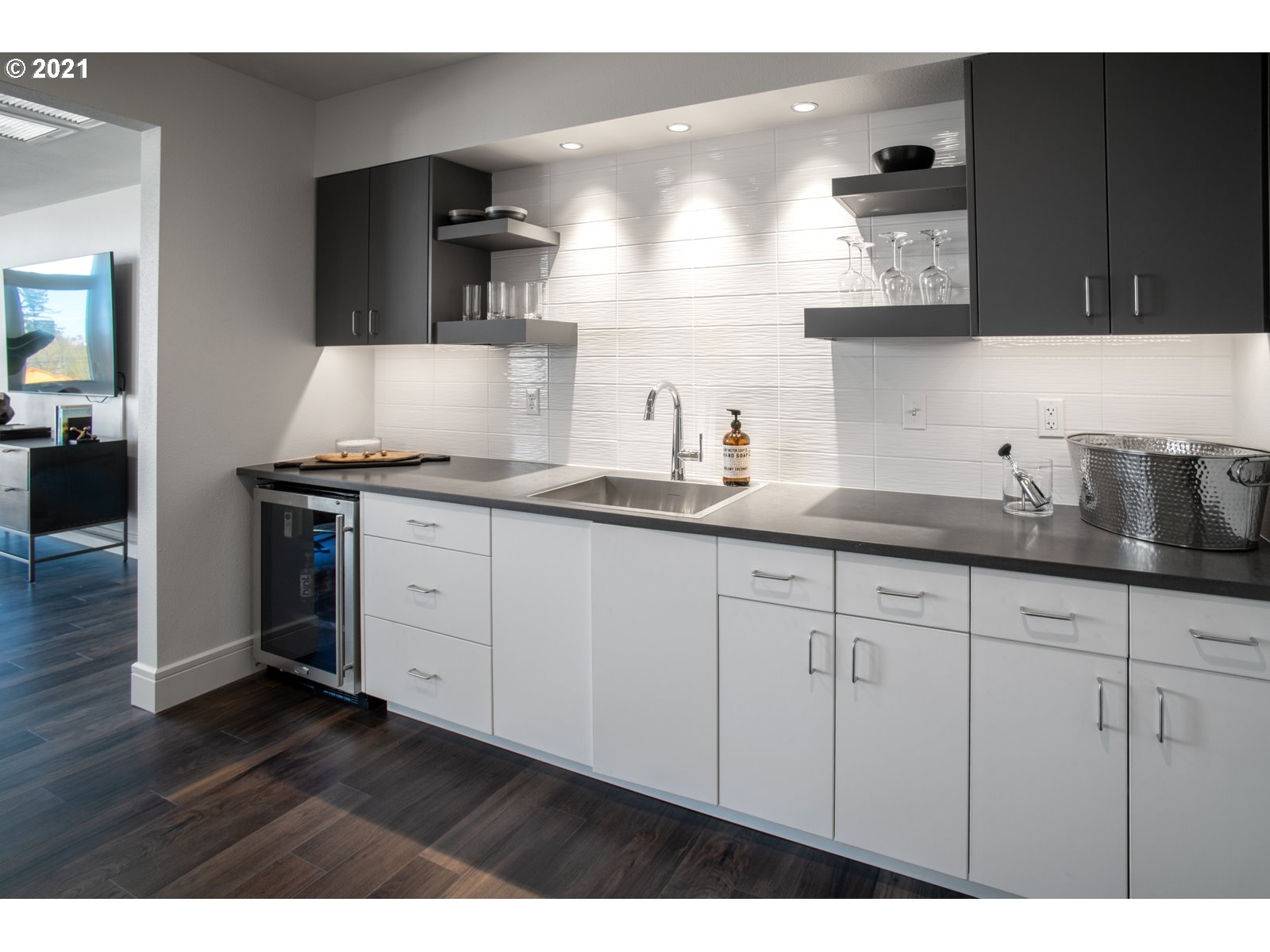 1600 Pearl Street, Unit 305 Eugene, OR 97401 - Photo 35 of 46 a kitchen with stainless steel appliances granite countertop a sink a stove and wooden cabinets