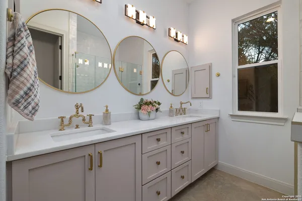 a bathroom with a shower and a sink