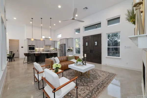 a living room with furniture and a fireplace