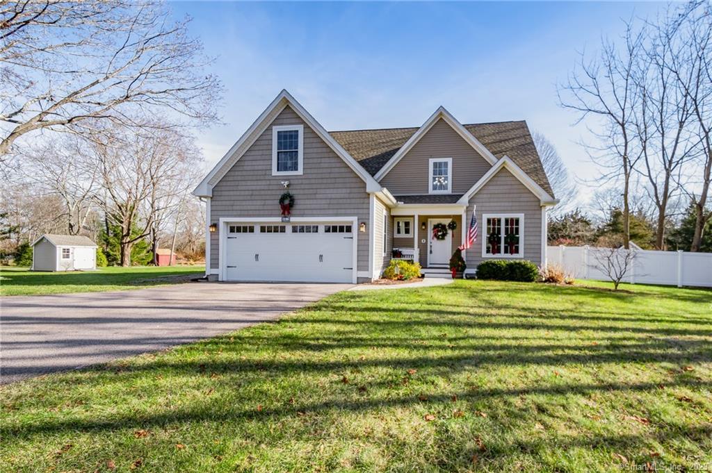 1146 Flanders Road Groton, CT 06355 - Photo 1 of 1 a front view of a house with a yard