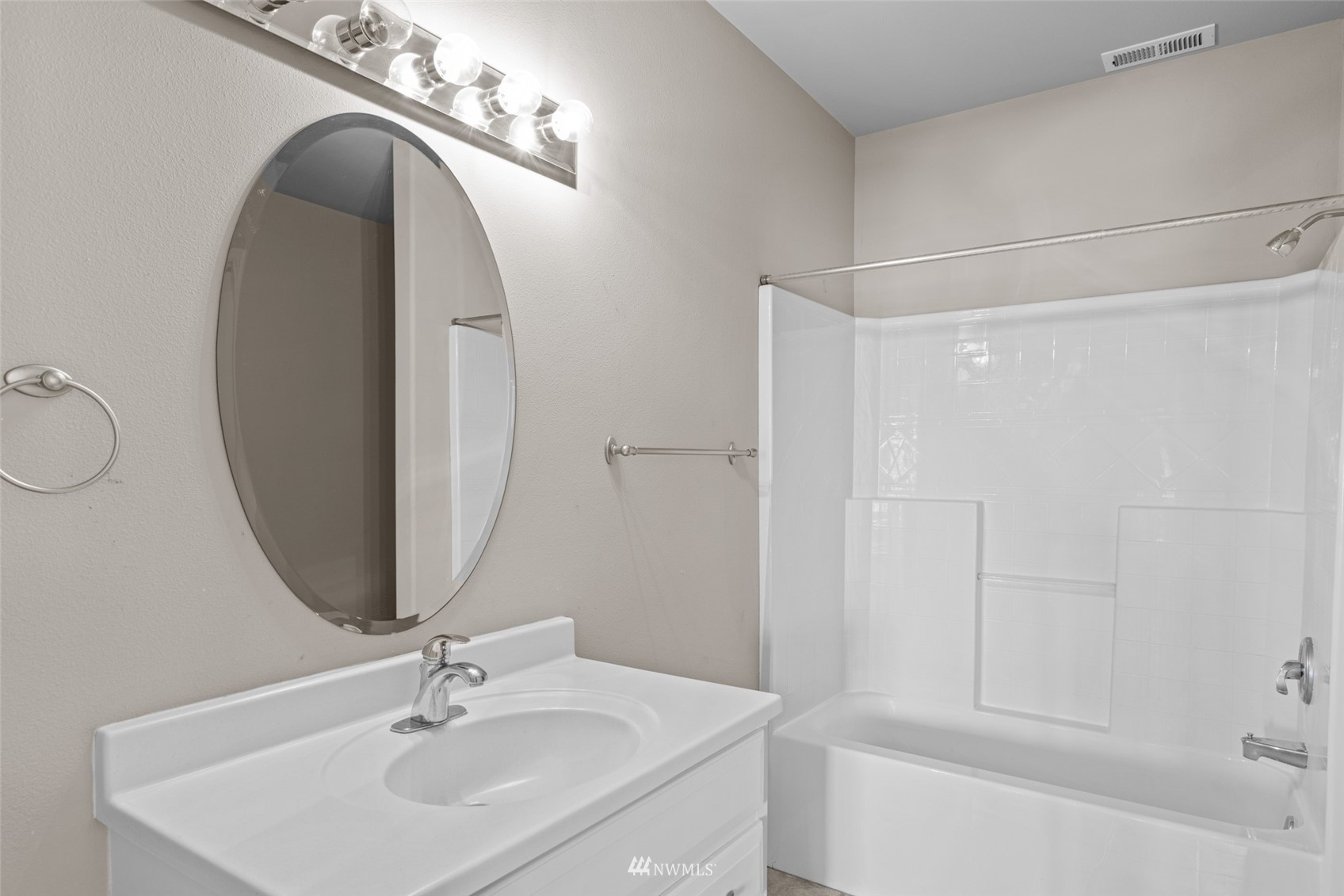 2448 Harvester Loop East Wenatchee, WA 98802 - Photo 24 of 28 a bathroom with a sink and a mirror