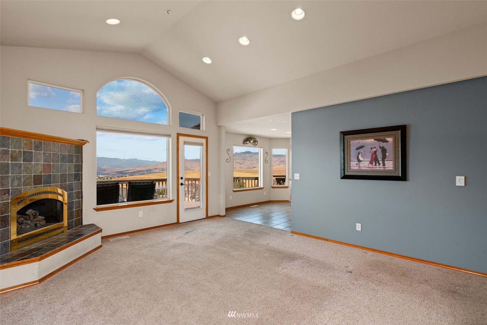 2448 Harvester Loop East Wenatchee, WA 98802 - Photo 5 of 28 a view of a livingroom with a fireplace and window