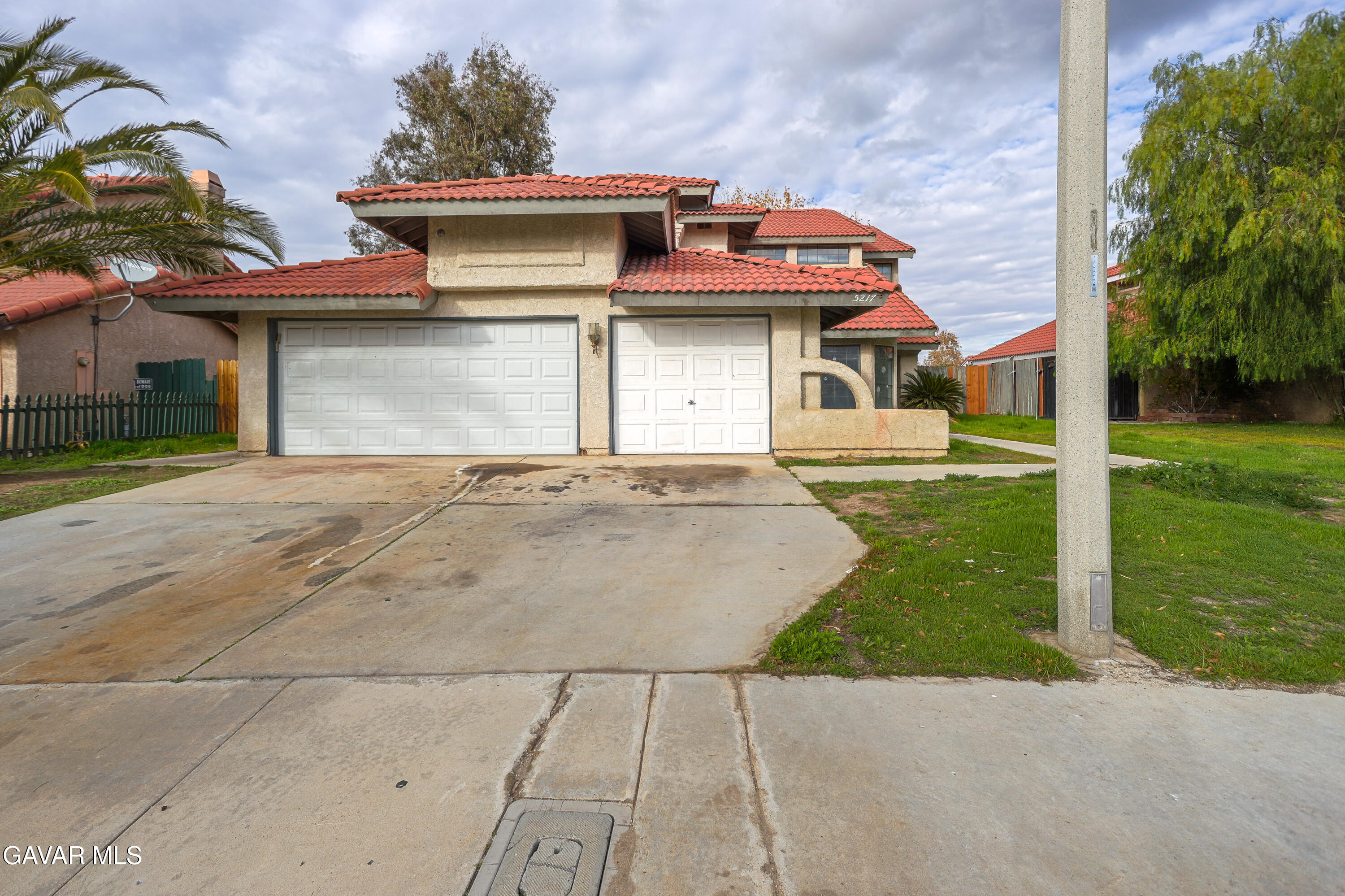 5217 East Ave R 4 Palmdale, CA 93552 - Photo 1 of 33 a front view of a house with a yard