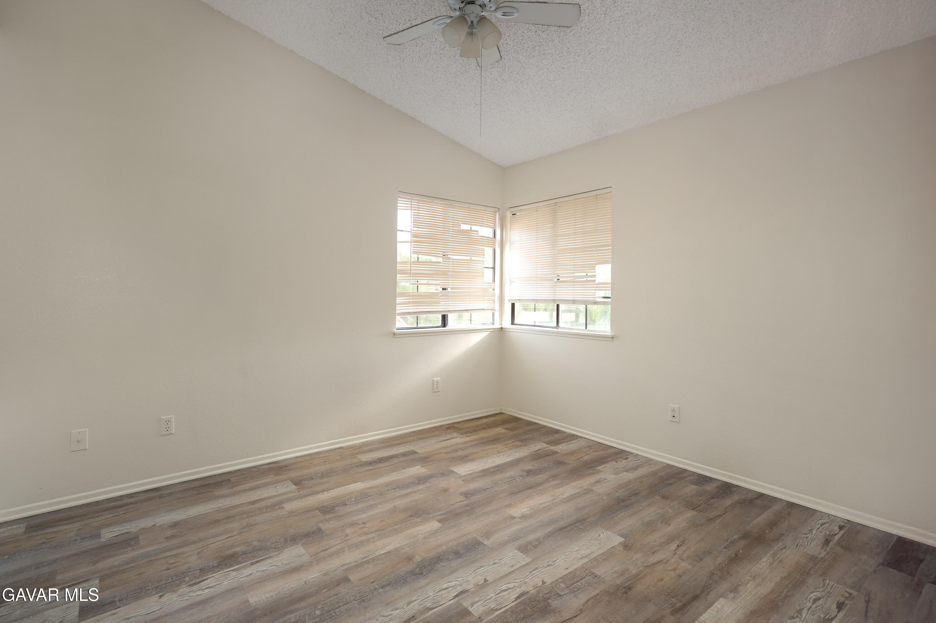 5217 East Ave R 4 Palmdale, CA 93552 - Photo 14 of 33 wooden floor in an empty room with a window