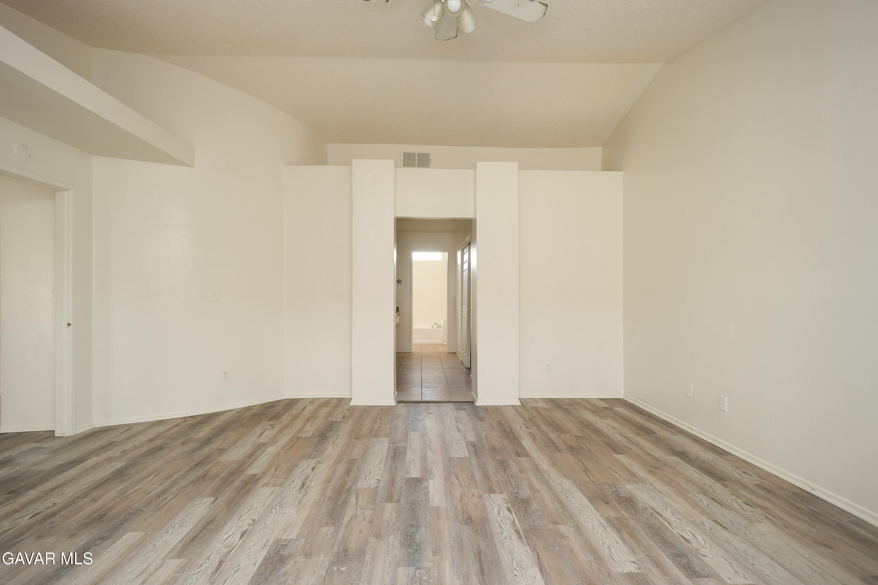 5217 East Ave R 4 Palmdale, CA 93552 - Photo 17 of 33 a view of empty room with wooden floor